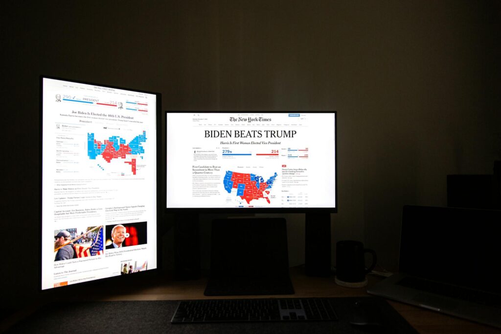 black flat screen computer monitor with headline news on display